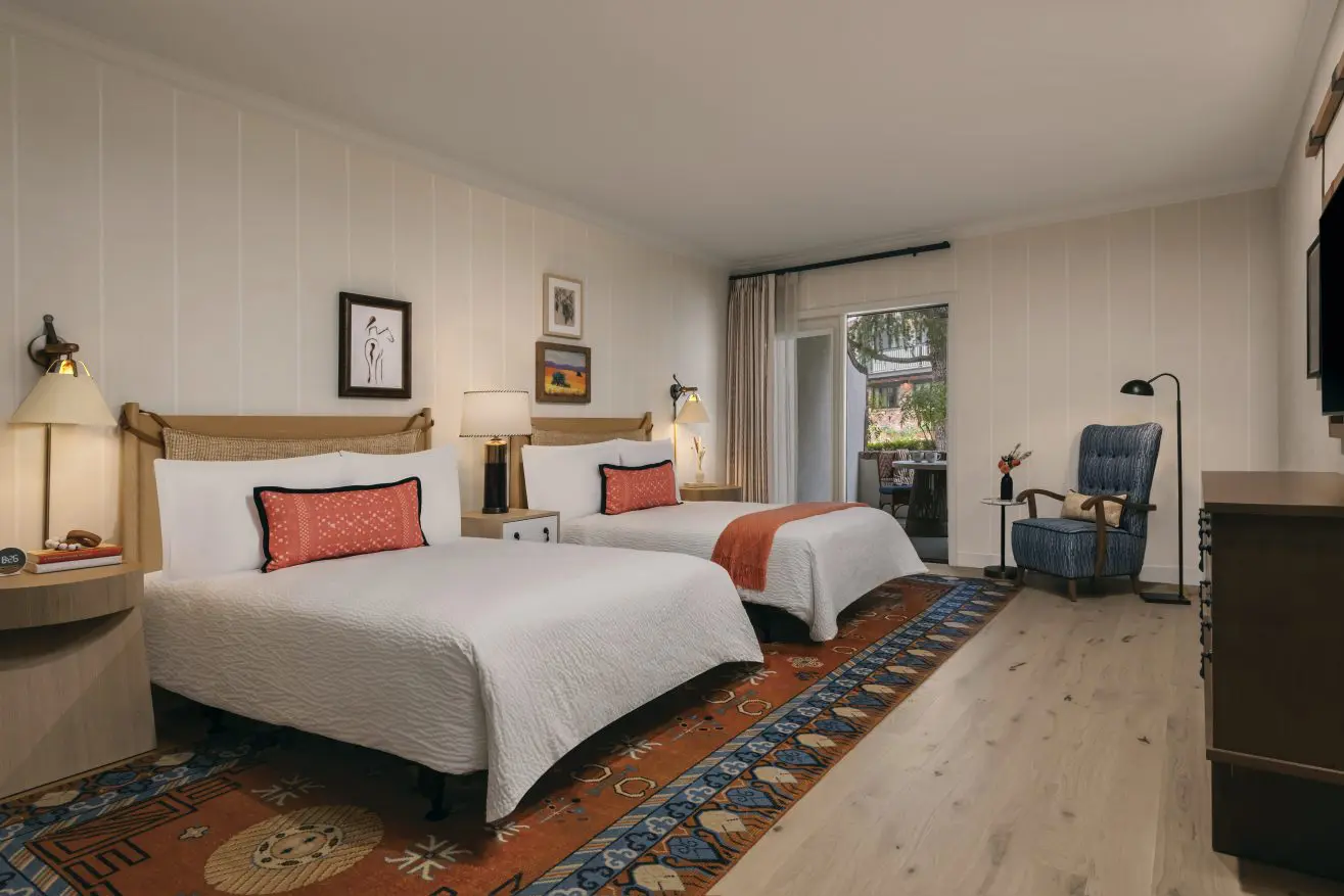 ADA Park Suite Room at Paso Robles Inn with 2 Full Beds, a living room and, and a outdoor patio.